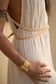 detail of golden Eri silk braids and charms on the Delphi Dress