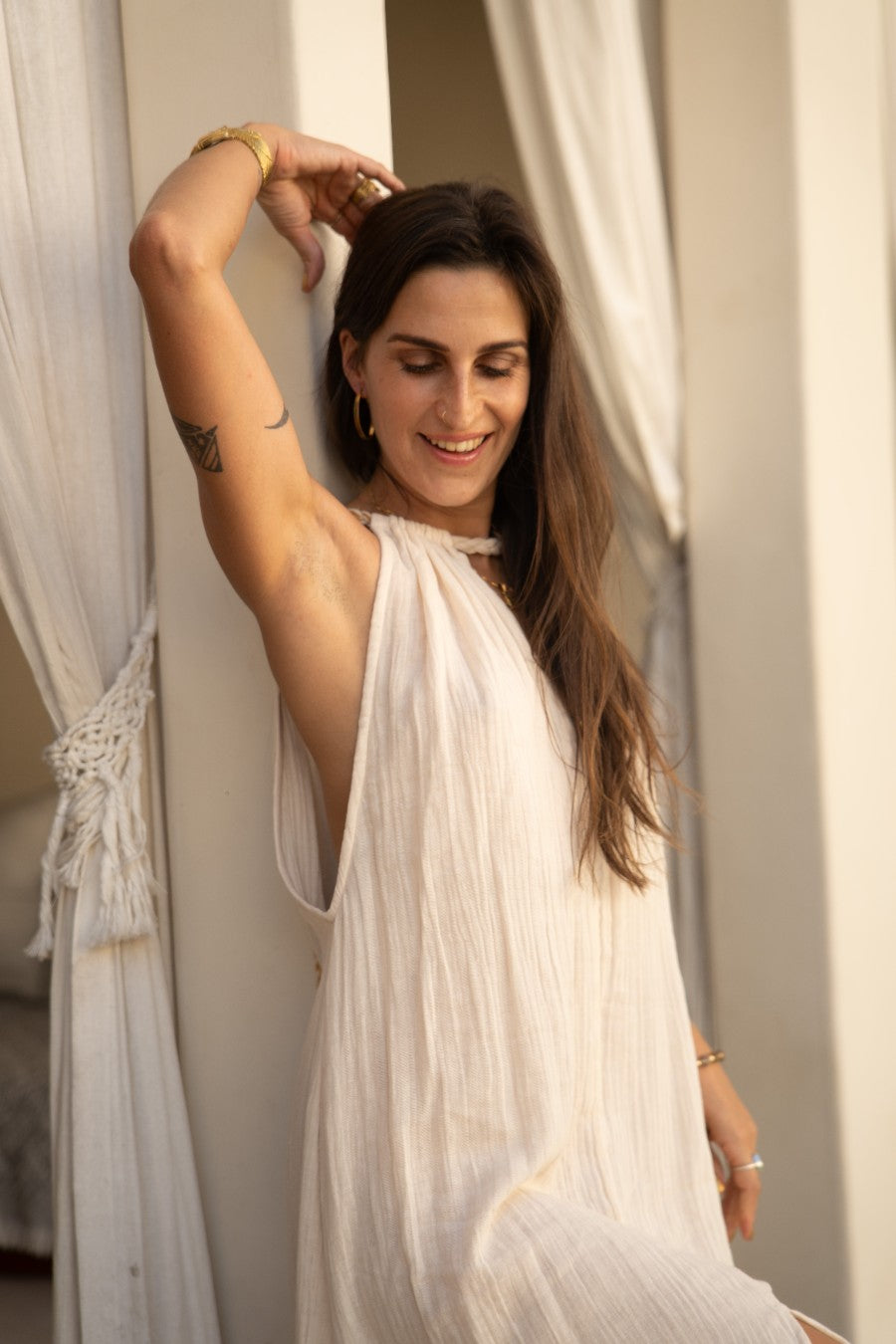 detail of golden Eri silk braids and charms on the Delphi Dress